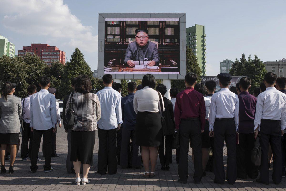 North Koreans watch a statement delivered by dictator Kim Jong Un on a television screen outside of the railway station in Pyongyang on Sept. 22, 2017. (ED JONES/AFP/Getty Images)