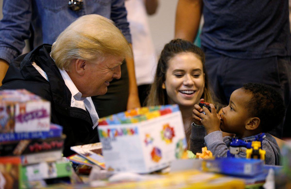 President Donald Trump visits with survivors of Hurricane Harvey at a relief center in Houston on Sept. 2, 2017. (REUTERS/Kevin Lamarque)