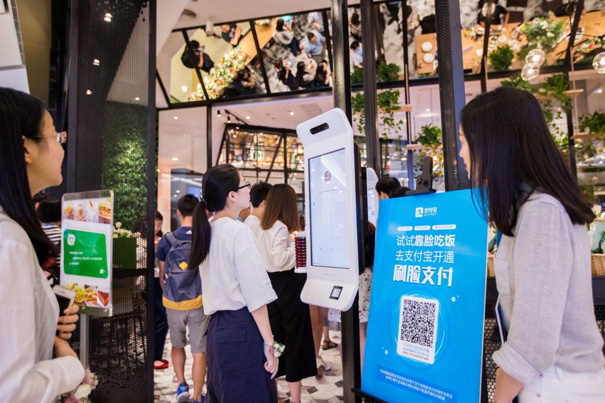 A customer tries Alipay's facial recognition payment solution "Smile to Pay" at KFC's new KPRO restaurant in Hangzhou, Zhejiang Province, China, on Sept. 1, 2017. (Stringer/Reuters)