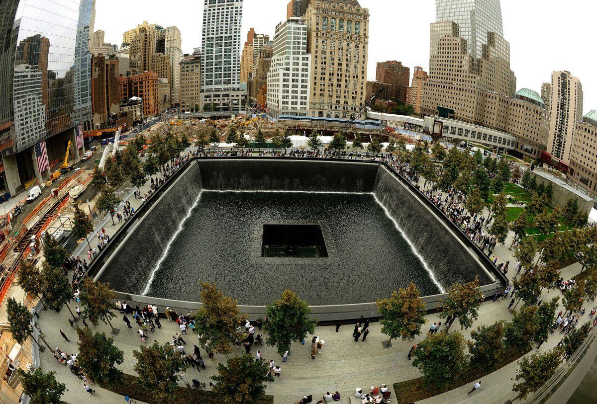 Families line up against the edges of the South Memorial pool during 10th anniversary ceremonies at the site of the World Trade Center on Sept. 11, 2011, in New York. (Timothy A. Clary/AFP/Getty Images)