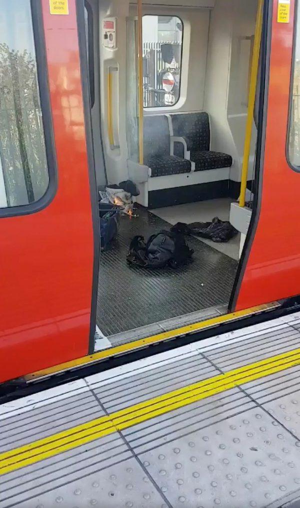 Personal belongings and a bucket with an item on fire inside it, are seen on the floor of an underground train carriage at Parsons Green station in West London on Sept. 15, 2017, in this image taken from social media. (Sylvain Pennec/via Reuters)