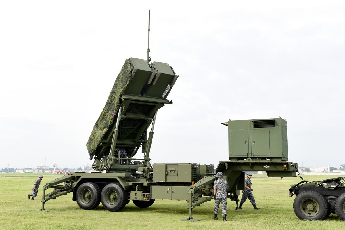 Soldiers from the Japan Air Self-Defense Force set up PAC-3 surface-to-air missile launch systems during a temporary deployment drill at US Yokota Air Base in Tokyo on Aug. 29, 2017. (TORU YAMANAKA/AFP/Getty Images)