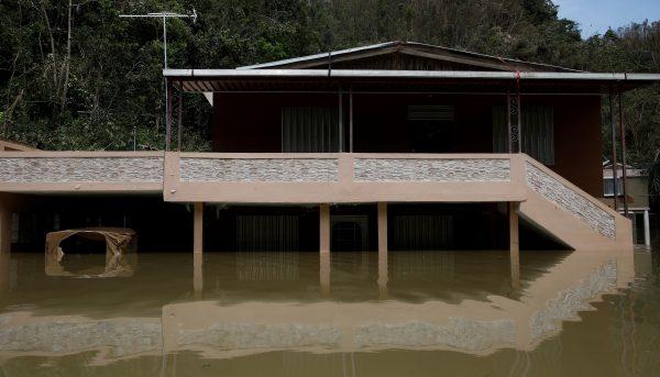 A house submerged by flood waters is seen close to the dam of the Guajataca lake after the area was hit by Hurricane Maria in Guajataca, Puerto Rico September 23, 2017. (Reuters/Carlos Garcia Rawlins)