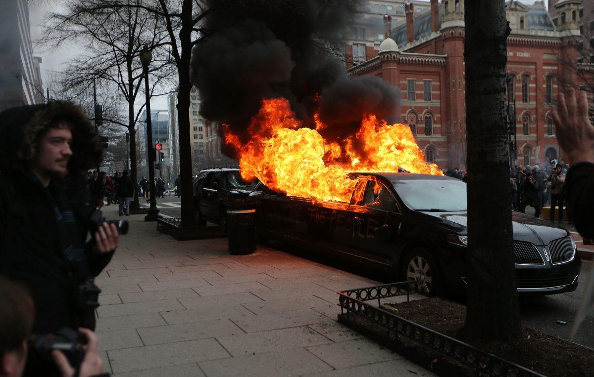 A limousine burns after being destroyed by anti-Trump protesters on K Street in Washington, DC, on Jan. 20, 2017. While protests were mostly peaceful, some turned violent. President-elect Donald Trump was sworn-in as the 45th U.S. President. (Mario Tama/Getty Images)