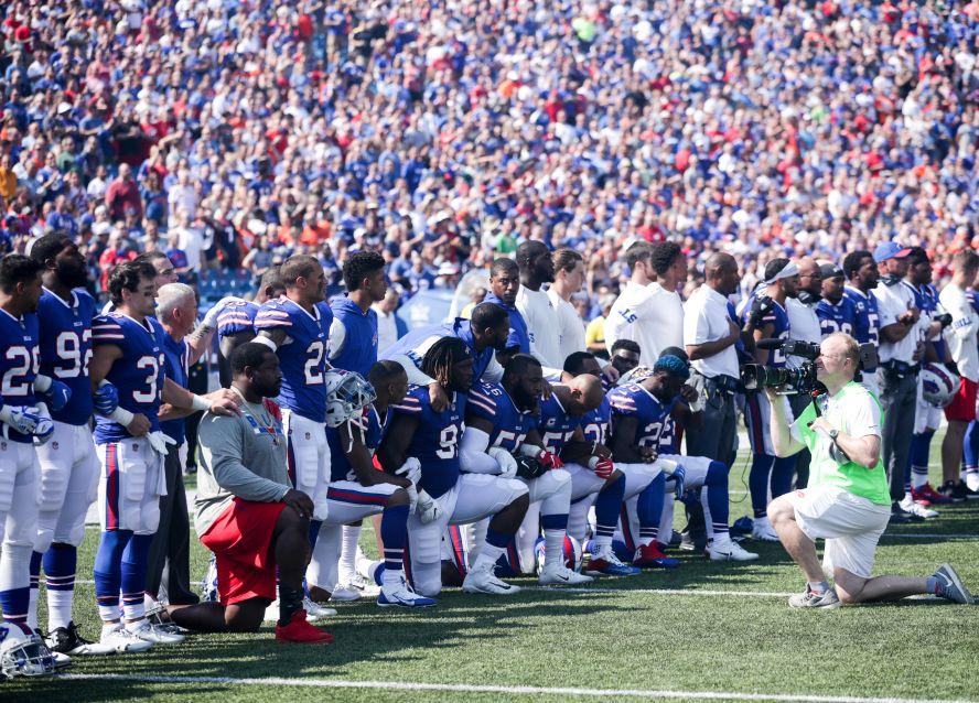 Buffalo Bills players kneel during the American national anthem before an NFL game against the Denver Broncos on Sept. 24, 2017, at New Era Field in Orchard Park, N.Y. (Brett Carlsen/Getty Images)