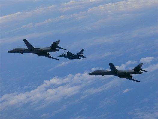Two U.S. Air Force B-1B Lancers assigned to the 9th Expeditionary Bomb Squadron, deployed from Dyess Air Force Base, Texas, fly with a Koku Jieitai (Japan Air Self-Defense Force) F-2 fighter jet over the East China Sea, on July 7, 2017. (Japan Air Self-Defense Force)