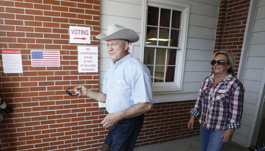 Alabama Republican U.S. Senate candidate Roy Moore and wife Kayla leave the Gallant Fire Hall after voting in the GOP runoff election in Gallant, Alabama, on Sept. 26, 2017. (Hal Yeager/Getty Images)
