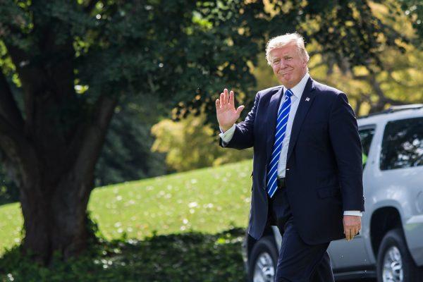 President Donald Trump walks to the South Lawn of the White House to board the Marine One on Sept. 26. (Samira Bouaou/The Epoch Times)
