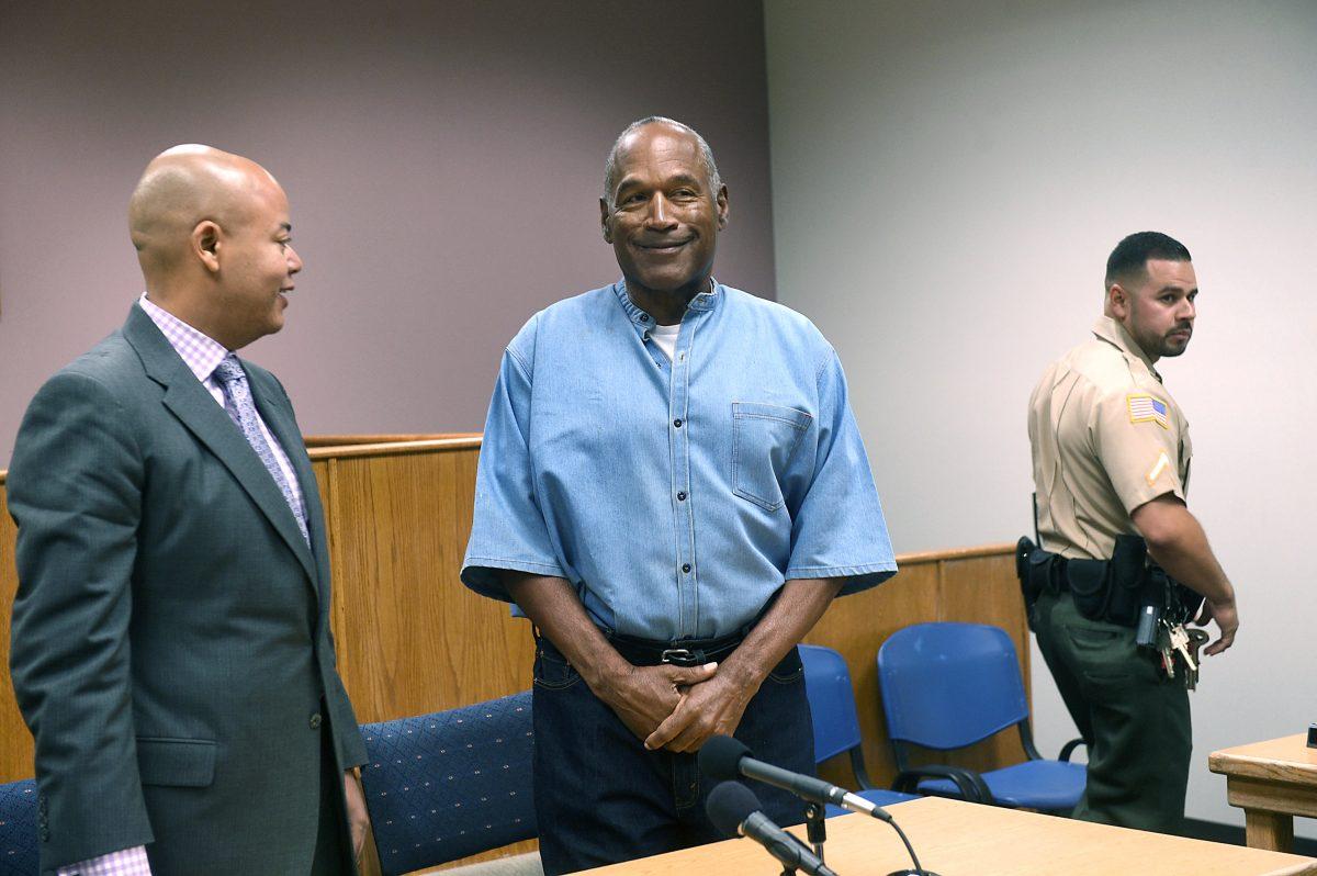 O.J. Simpson (C) arrives for his parole hearing with his attorney Malcolm LaVergne (L) at Lovelock Correctional Center July 20, 2017, in Lovelock, Nevada. (Jason Bean-Pool/Getty Images)