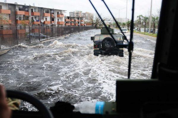 Puerto Rico National Guardsmen patrol a highway in Carolina, Puerto Rico on Sept. 22, after Hurricane Maria caused extensive flooding. (Puerto Rico National Guard photo by Sgt. Jose Ahiram Diaz-Ramos)
