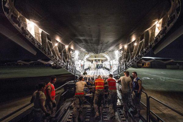 Airmen load a C-17 Globemaster III with palletized food and water at Joint Base San Antonio-Kelly Field, Texas, on Sept. 23, 2017, to support relief efforts in Puerto Rico and Saint Croix following Hurricane Maria. (Air Force photo by Staff Sgt. Keith James)