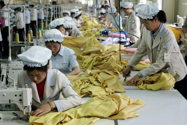 Women work at the assembly line of a South Korean textile factory in Kaeson, North Korea, on May 22, 2007. (Chung Sung-Jun/Getty Images)