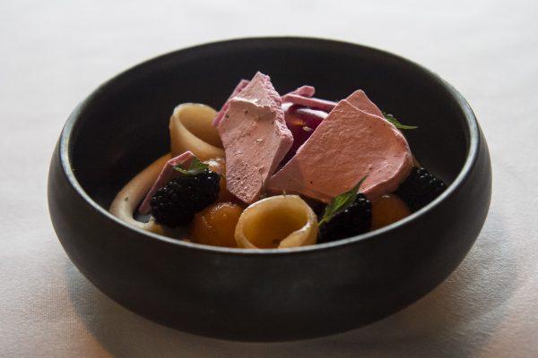 Chino Farms French melon, fresh blackberries, sangria sorbet, raspberry meringue shards, garnished with anise hyssop blossoms at California Modern at George’s At The Cove. (Channaly Philipp/The Epoch Times)