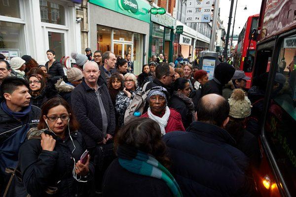 Commuters wait to board buses in Brixton south London on Jan. 9, 2017, during a 24-hour tube strike. (Niklas Hallen/AFP/Getty Images)