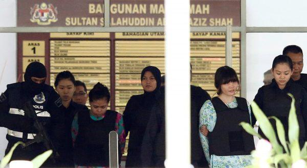Vietnamese Doan Thi Huong and Indonesian Siti Aisyah who are on trial for the killing of Kim Jong Nam, the estranged half-brother of North Korea's leader, are escorted as they leave the Shah Alam High Court on the outskirts of Kuala Lumpur, Malaysia October 3, 2017. REUTERS/Lai Seng Sin)