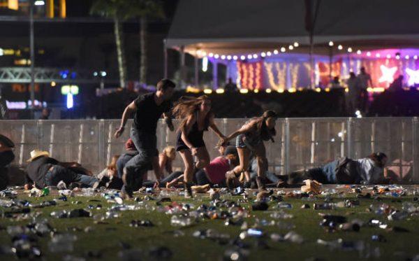 People run from the Route 91 Harvest country music festival after gun fire was heard in Las Vegas on Oct. 1, 2017. (David Becker/Getty Images)