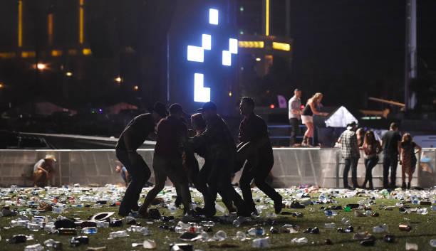 People carry a person at the Route 91 Harvest country music festival after apparent gunfire was heard on Oct. 1, 2017, in Las Vegas.  (David Becker/Getty Images)
