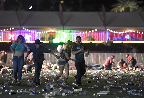 People run from the Route 91 Harvest country music festival after gunfire was heard in Las Vegas on Oct. 1, 2017. (David Becker/Getty Images)