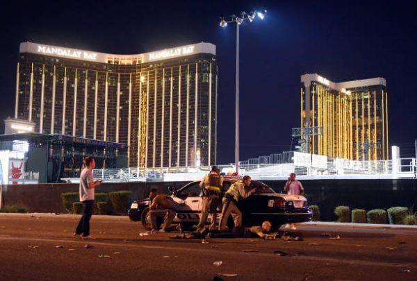 Las Vegas police stand guard along the streets outside the Route 91 Harvest Country music festival grounds after gunfire was heard in Las Vegas on Oct. 1, 2017. (David Becker/Getty Images)