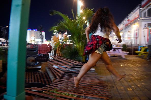 A person runs from the Route 91 Harvest country music festival after gunfire was heard in Las Vegas on Oct. 1, 2017. (David Becker/Getty Images)