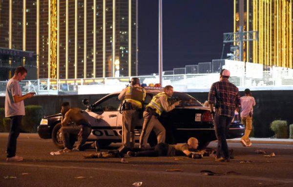 Las Vegas police stand guard along the streets outside the Route 91 Harvest country music festival grounds after an active shooter was reported in Las Vegas on Oct. 1, 2017. (David Becker/Getty Images)
