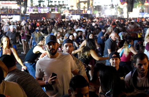 People flee the Route 91 Harvest country music festival after gunfire was heard in Las Vegas on Oct. 1, 2017. (David Becker/Getty Images)