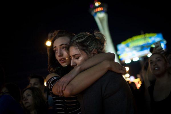 Mourners attend a candlelight vigil for the victims of Sunday night's mass shooting in Las Vegas, on Oct. 2, 2017. The massacre is one of the deadliest mass shooting events in U.S. history. As stories of the night come out, the heroic actions of many are coming to light. (Drew Angerer/Getty Images)