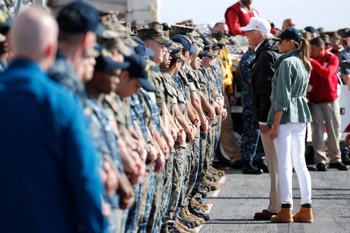 President Donald Trump and first lady Melania Trump greet troops as they depart the USS Kearsarge off the coast of San Juan, Puerto Rico on Oct. 3, 2017. (REUTERS/Jonathan Ernst)