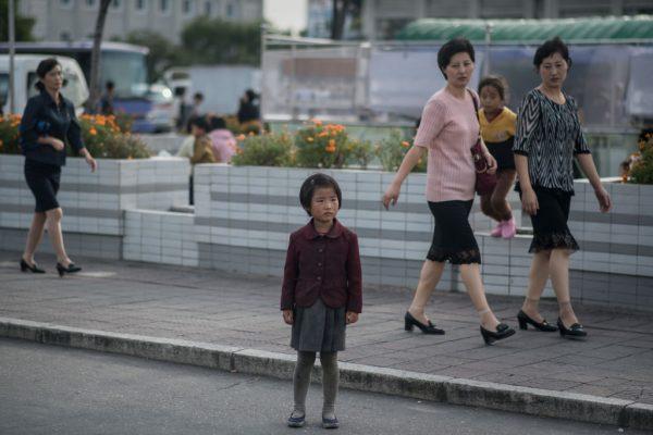 In a photo taken on September 27, 2017 a child stands on a roadside in Pyongyang. (Ed Jones /AFP/Getty Images)