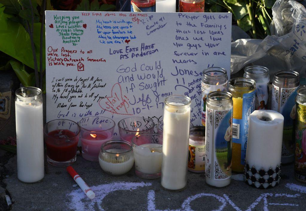 Candles and a card are left at a makeshift memorial outside the Route 91 music festival site beside the Mandalay Hotel on October 4, 2017. (MARK RALSTON/AFP/Getty Images)