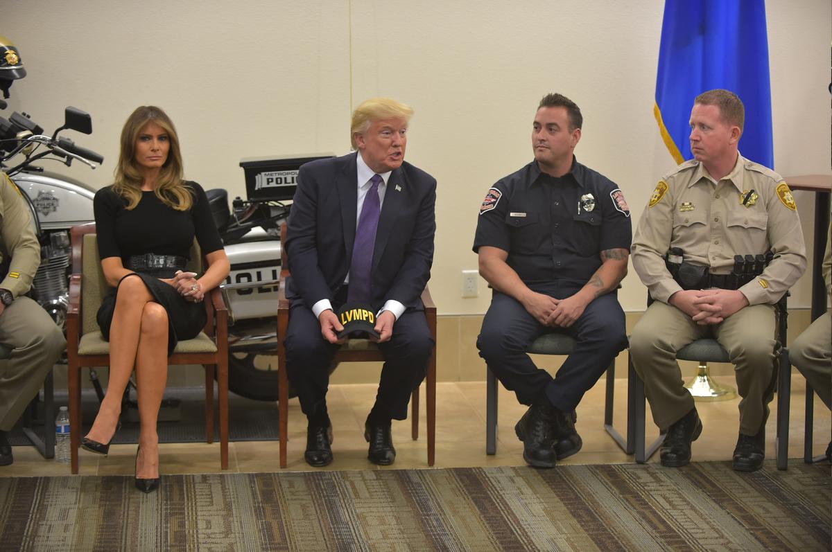 President Donald Trump and First Lady Melania Trump visit with volunteers and first responders at the Metropolitan Police Department in Las Vegas on October 4, 2017. (MANDEL NGAN/AFP/Getty Images)