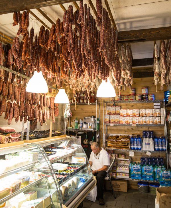 At Calabria Pork Store, a "sausage chandelier" is made up of the shop's cured meats. (Benjamin Chasteen/The Epoch Times)