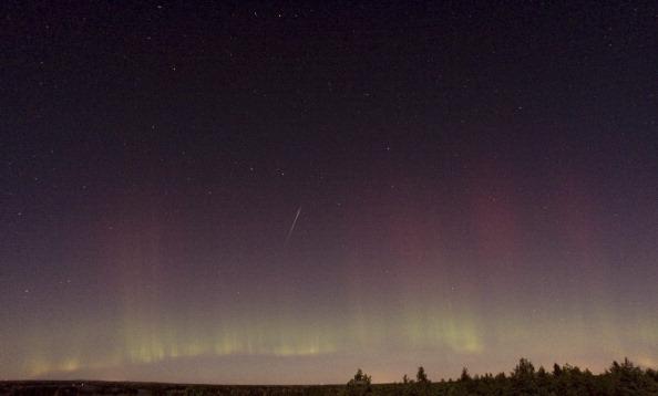 View of a shooting star (Draconid) and northern light near Skekarsbo at the Farnebofjardens national park 150 kilometers north of Stockholm, late on Oct. 8, 2011. (P-M HEDEN/AFP/Getty Images)