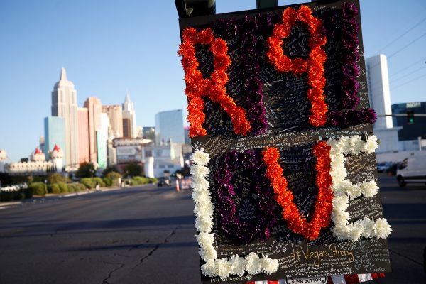 Messages are pictured on a sign at a makeshift memorial in the middle of Las Vegas Boulevard following the mass shooting in Las Vegas, Nevada, U.S., October 5, 2017. REUTERS/Chris Wattie