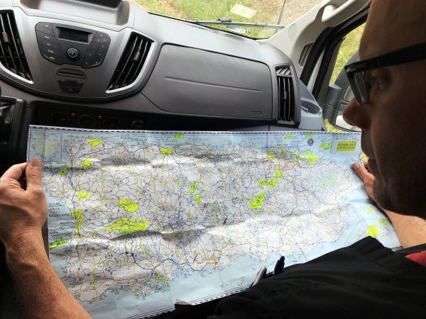 Dr. Humberto Guzman reviews a map of Puerto Rico to find remote villages cut off from medical access in the days since Hurricane Maria in Orocovis, Puerto Rico on October 3, 2017. (Reuters/Robin Respaut)