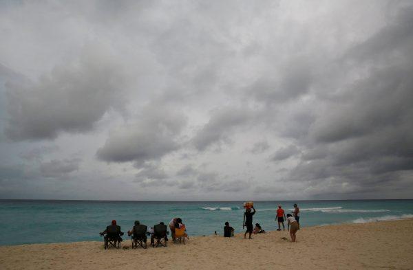 Tourists are pictured at the beach as Tropical Storm Nate approaches in Cancun, Mexico October 6, 2017. (Reuters/Henry Romero)