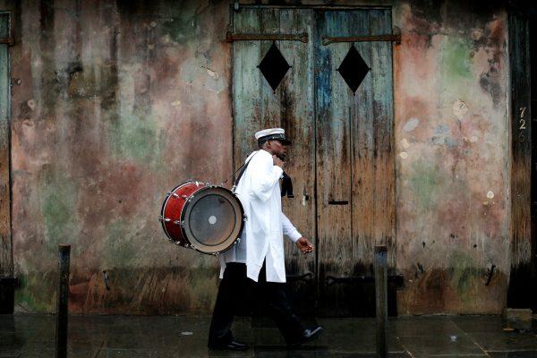A musician walks in the French Quarter as Hurricane Nate approaches the U.S. Gulf Coast in New Orleans, Louisiana, U.S. October 7, 2017. (Reuters/Jonathan Bachman)
