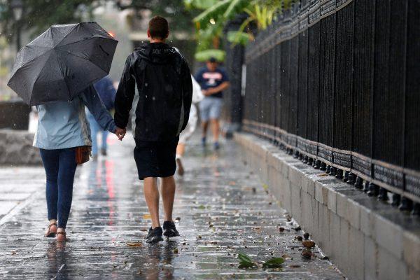 A couple walks in the French Quarter as Hurricane Nate approaches the U.S. Gulf Coast in New Orleans, Louisiana, U.S. on October 7, 2017. (Reuters/Jonathan Bachman)