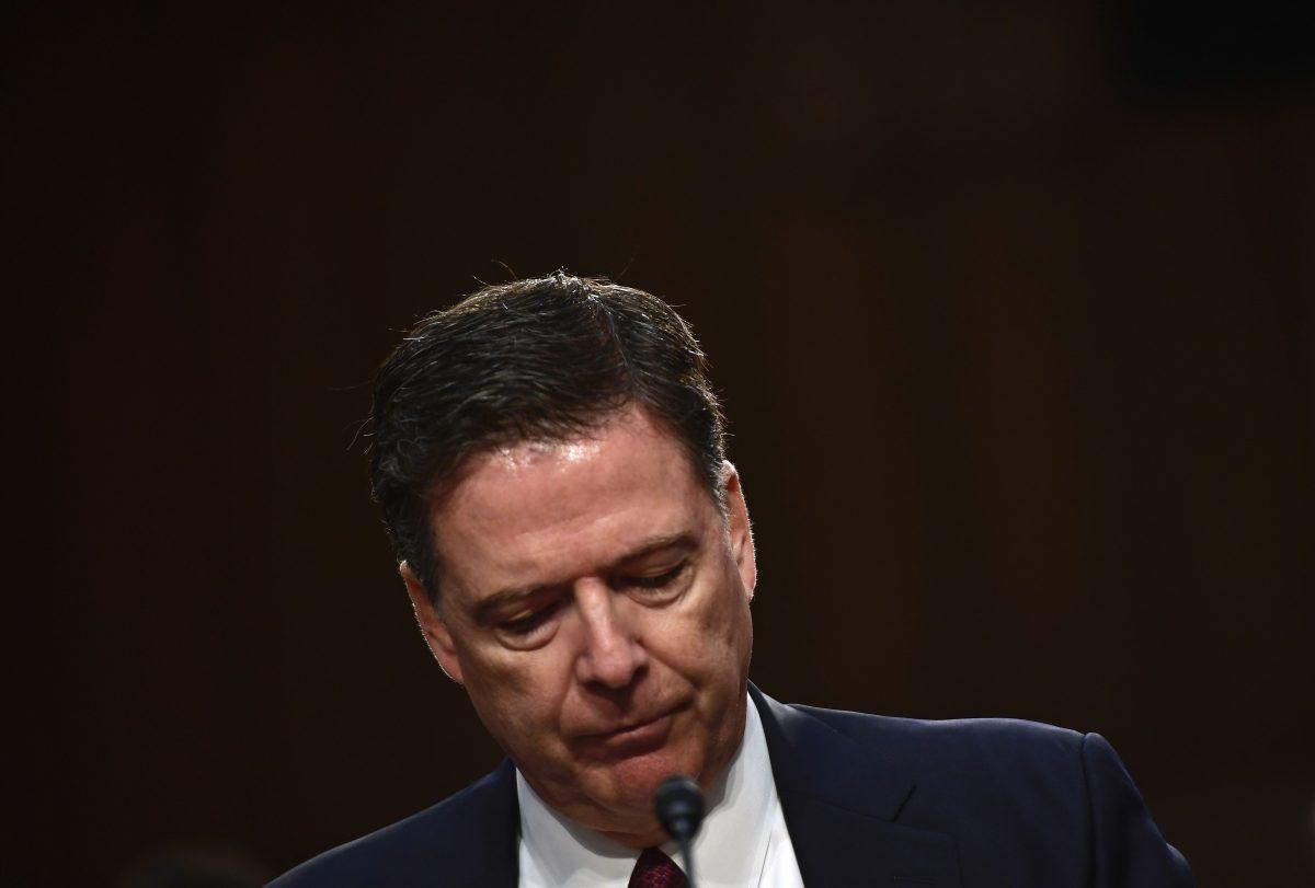 Former FBI Director James Comey pauses as he testifies before a Senate Intelligence Committee hearing on Russia's alleged interference in the 2016 U.S. presidential election on Capitol Hill in Washington on June 8, 2017. (BRENDAN SMIALOWSKI/AFP/Getty Images)