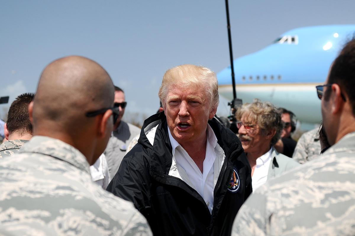 President Donald Trump shakes hands with service members during a visit to Carolina, Puerto Rico, on Oct. 3, 2017. (Puerto Rico National Guard photo by Sgt. José Ahiram Díaz)