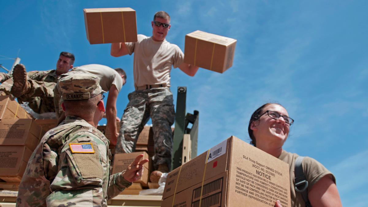 Soldiers assigned to the 14th Combat Support Hospital, 44th Medical Brigade from Fort Benning, Georgia, unload water and other hurricane relief supplies in Humacao, Puerto Rico, Oct. 8, 2017. (Army photo by Sgt., Thomas Calvert)