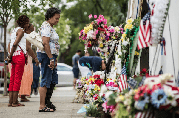 Cheryl Reifer looks at the memorial outside Emanuel AME Church in Charleston, S.C., on July 31, 2015. Earlier in the morning, Dylann Roof, the shooter in the June 17 massacre was arraigned on 33 federal charges, including hate crimes. (Sean Rayford/Getty Images)