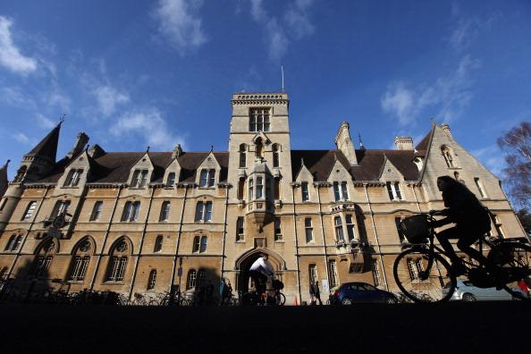 A woman cycles past Balliol College in Oxford city centre. Balliol College was founded in around 1263. (Oli Scarff/Getty Images)