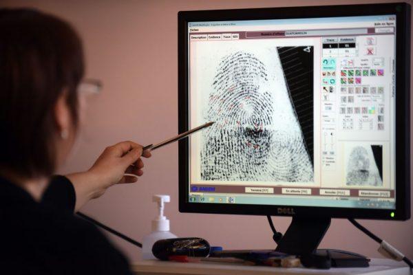 A French police officer works with an automated fingerprint identification file on April 5, 2016. Fingerprints can reveal far more than the identity of the individual, with a new technique pioneered by British researchers. (Remy Gabala/AFP/Getty Images)