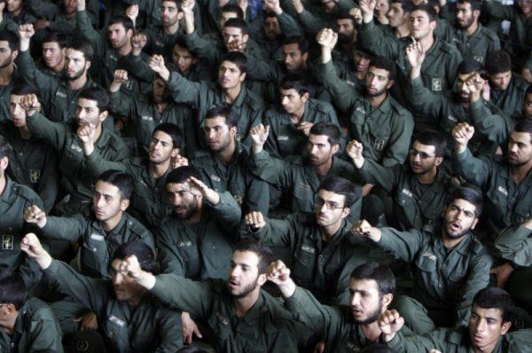 Iranian revolutionary guards chant slogans during Friday prayers in Tehran May 26, 2006. (REUTERS/Raheb Homavandi)