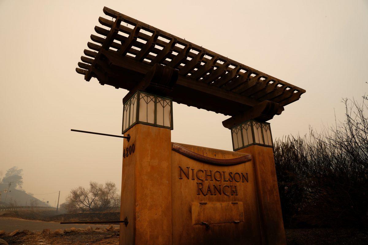A charred entrance to the Nicholson Vineyards and Winery damaged by the Partrick Fire is seen in Sonoma, California, Oct. 11, 2017. (REUTERS/Stephen Lam)