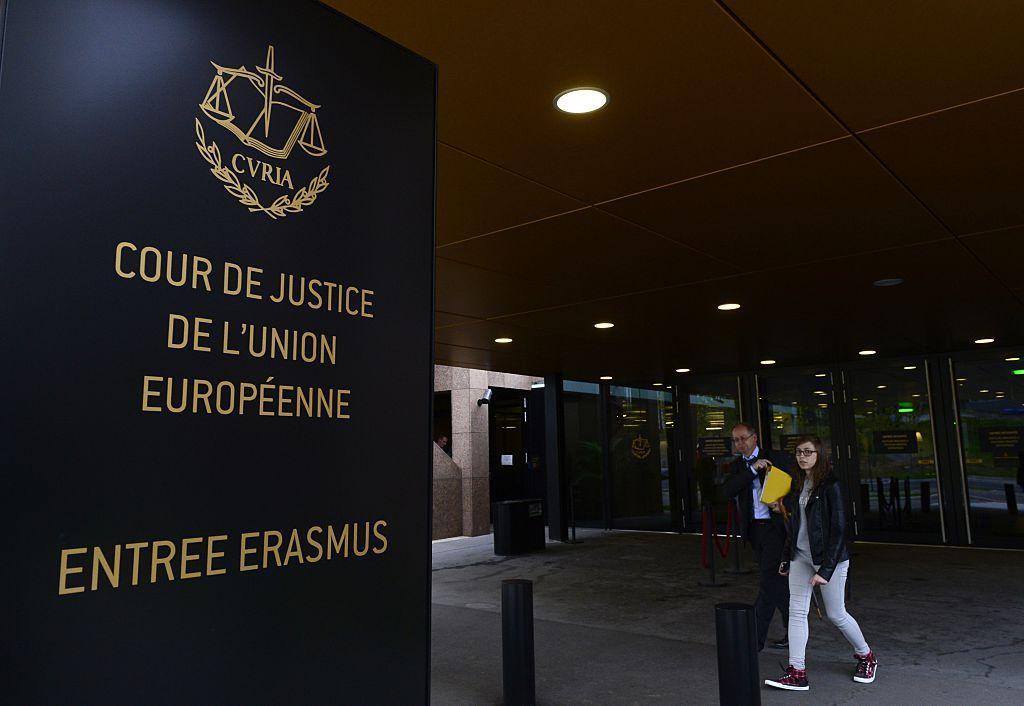 People walk away from the entrance of the European Court of Justice in Luxembourg, on October 5, 2015. (John Thys/AFP/Getty Images)