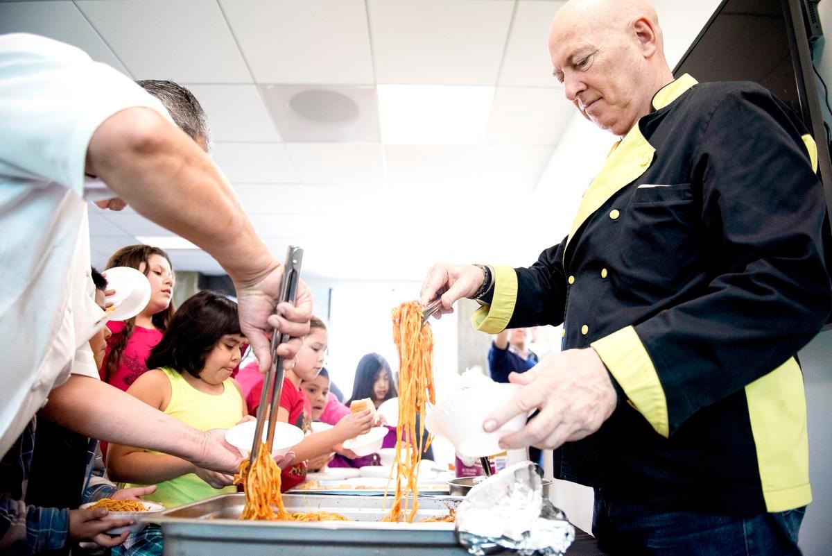 Chef Bruno Serato serves up pasta for Caterina's Club at Christ Cathedral in Garden Grove on Tuesday, February 14, 2017. After Serato's White House restaurant burned down, Christ Cathedral stepped in, volunteering their kitchen so Serato can continue to feed Orange County's underprivileged children daily. (Matt Masin/Orange County Register/SCNG)