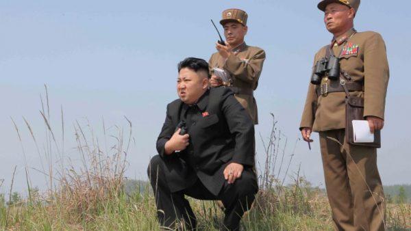 North Korean leader Kim Jong Un (C) guides the multiple-rocket launching drill in this undated photo released by North Korea's Korean Central News Agency (KCNA) April 24, 2014. (KCNA via ReutersS/File Photo)