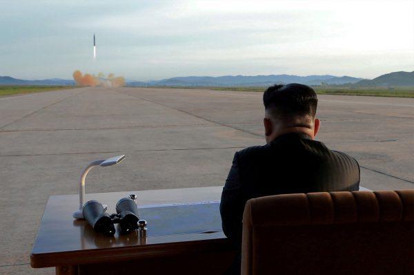 FILE PHOTO: North Korean leader Kim Jong Un watches the launch of a Hwasong-12 missile in this undated photo released by North Korea's Korean Central News Agency (KCNA) on September 16, 2017. KCNA via Reuters/File Photo